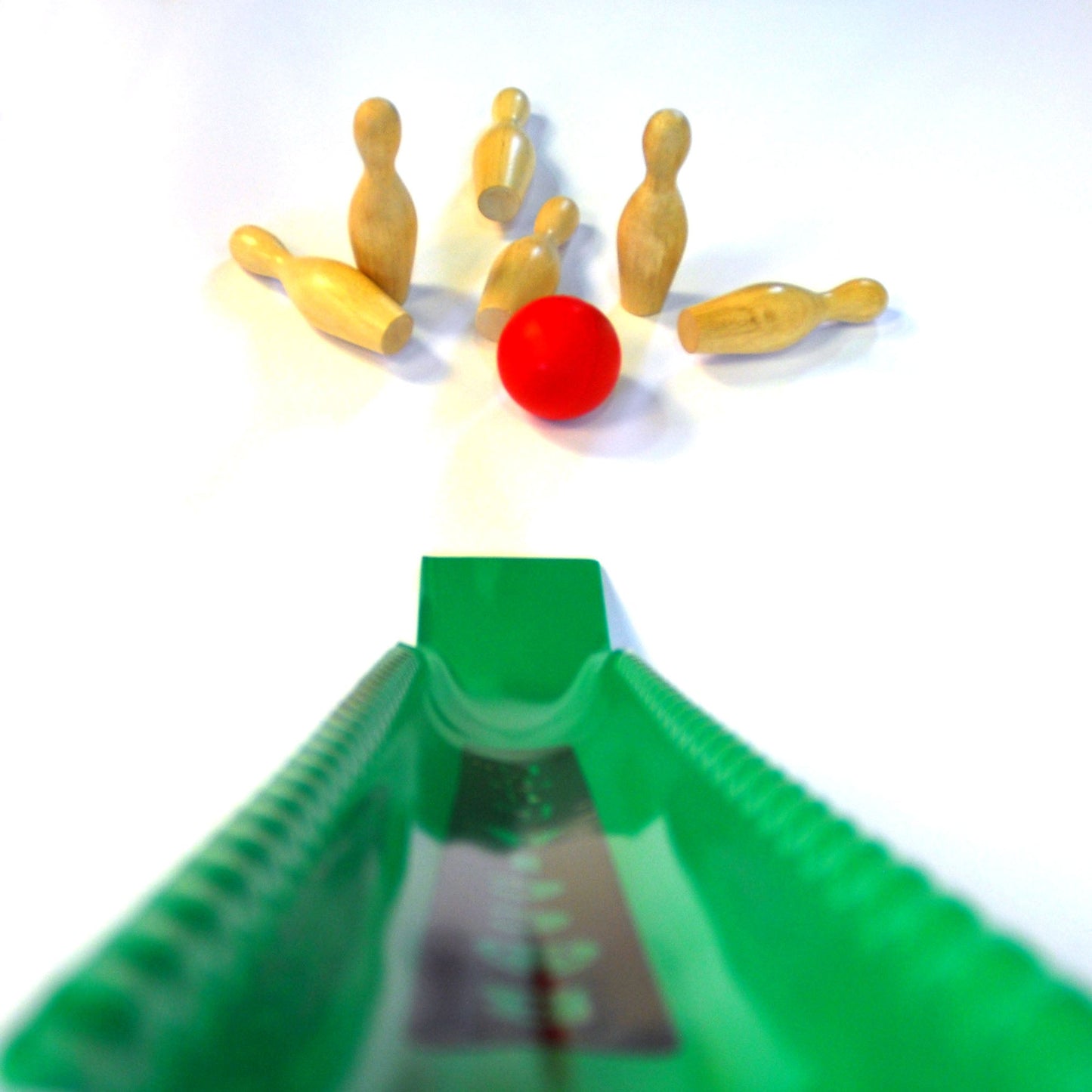 Boccla Lite skittles kit showing one balls and 6 wooden skittles , view from user's perspective