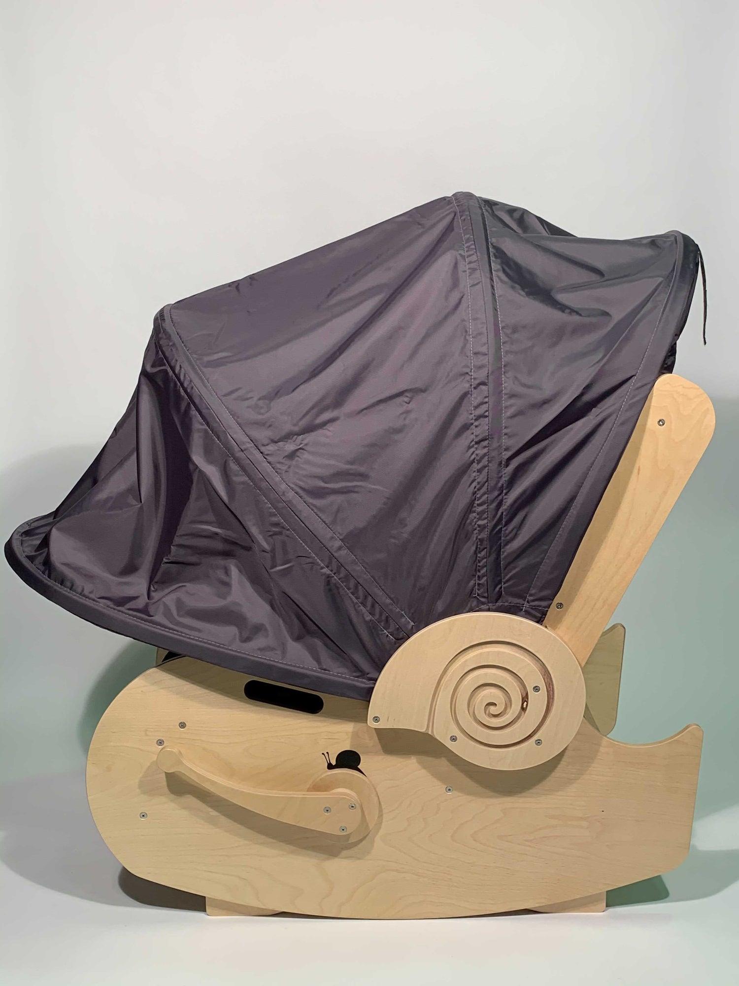 Side view of sensory shell chair with hood down