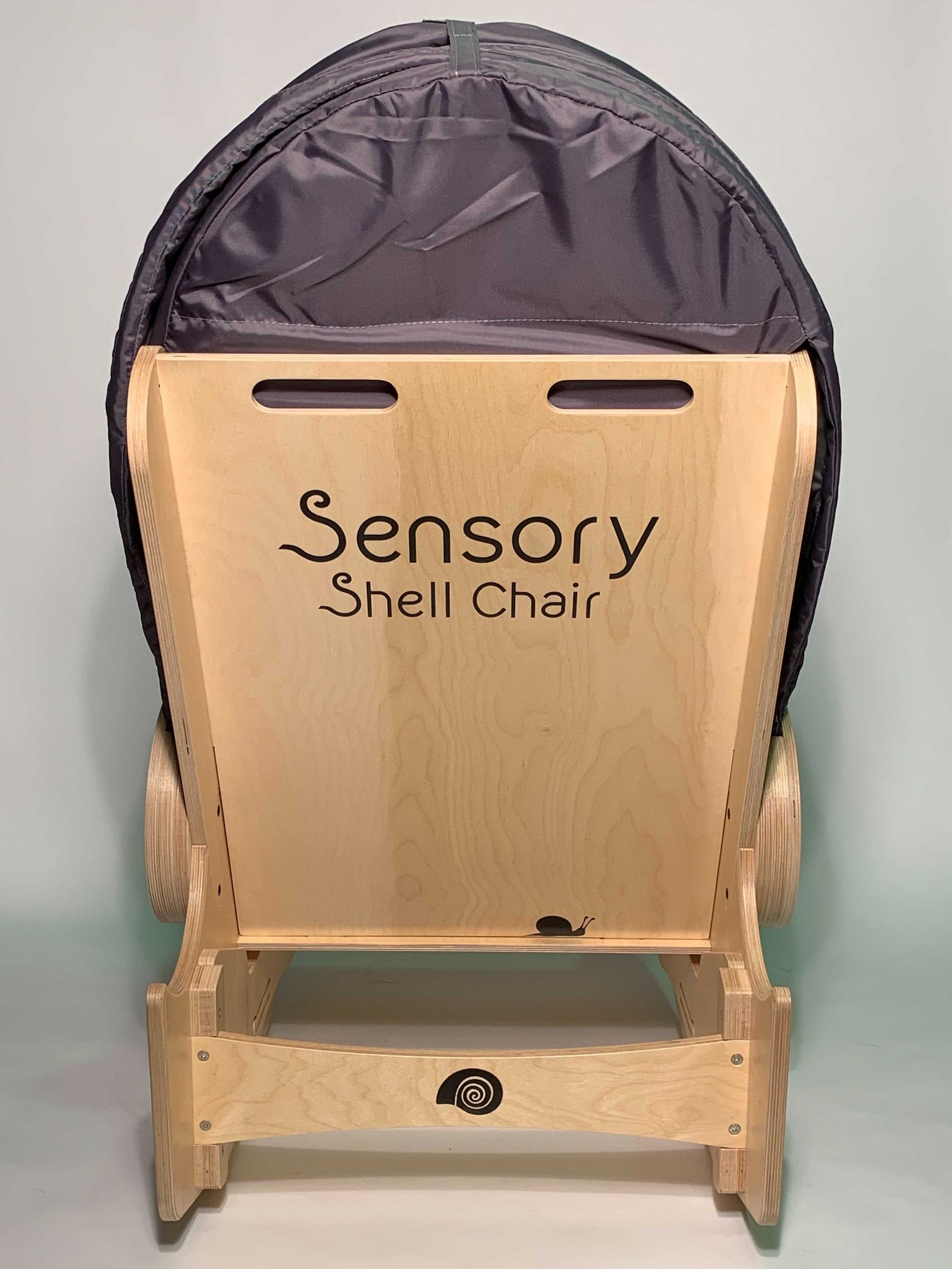 Back view of sensory shell chair showing handles and foot rocker